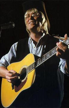 Wayne Denton as John Denver