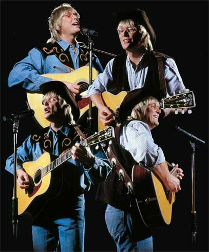 Wayne Denton as John Denver